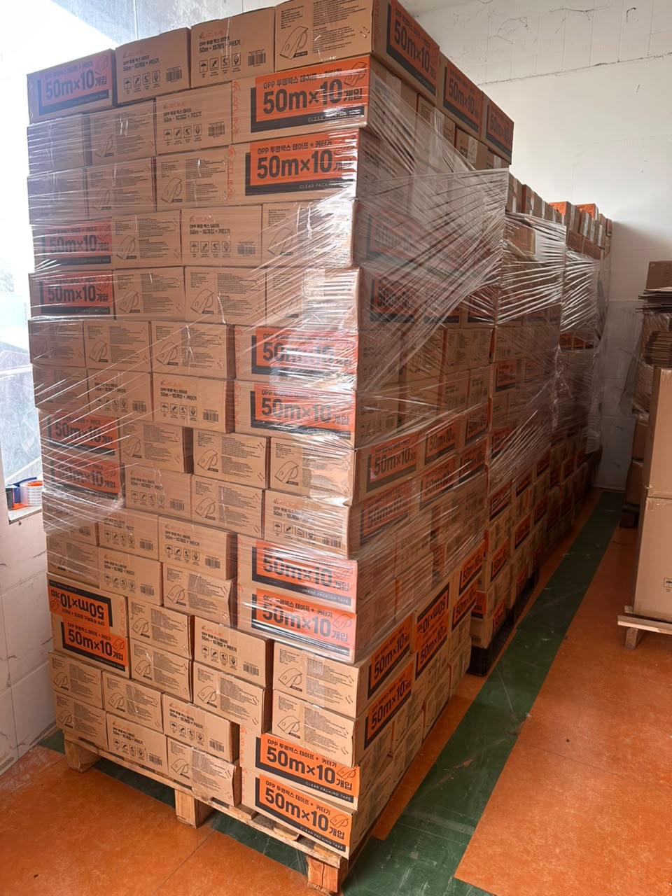 Real NitaSource packing tape project: cartons stacked on wooden pallets and secured with stretch wrap