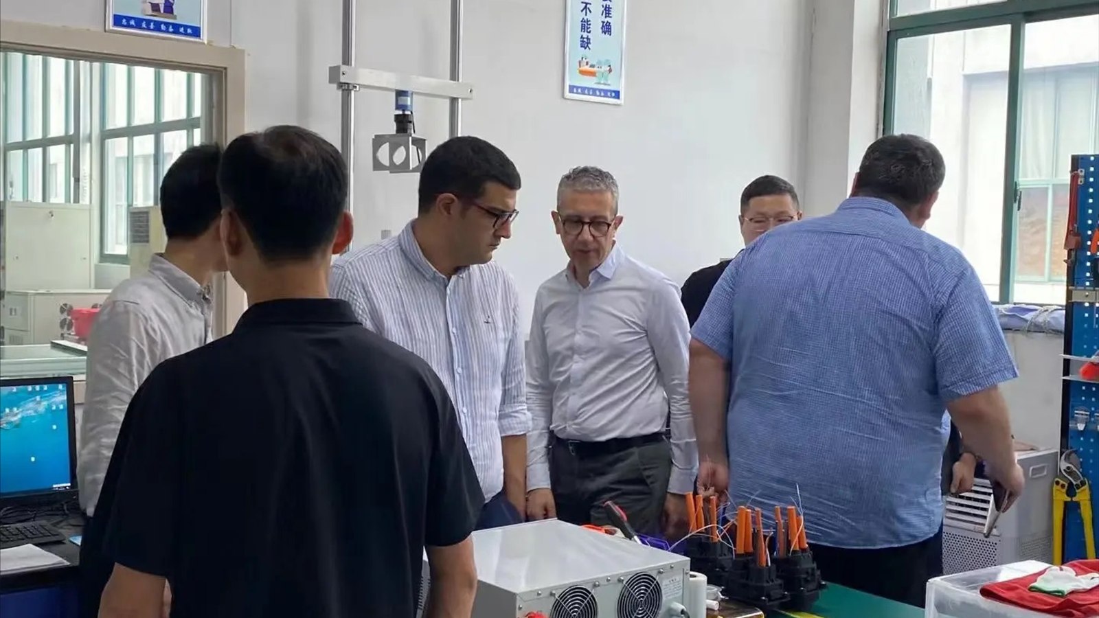 Buyers and supplier staff reviewing product components