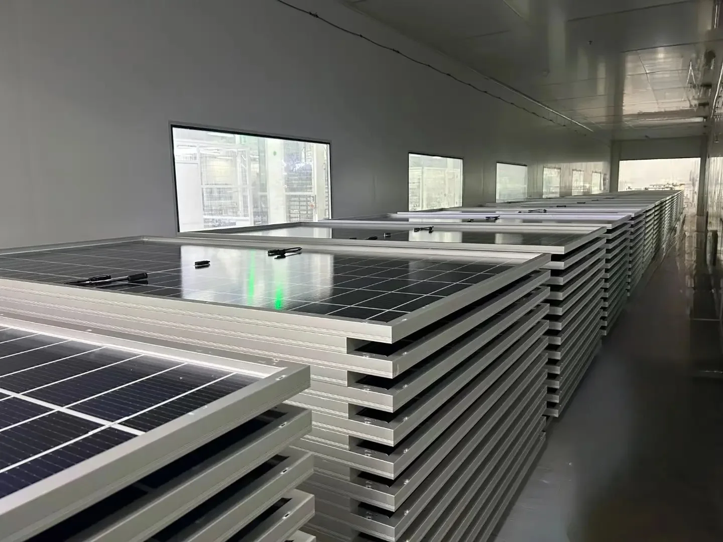 Solar panels stacked in a workshop
