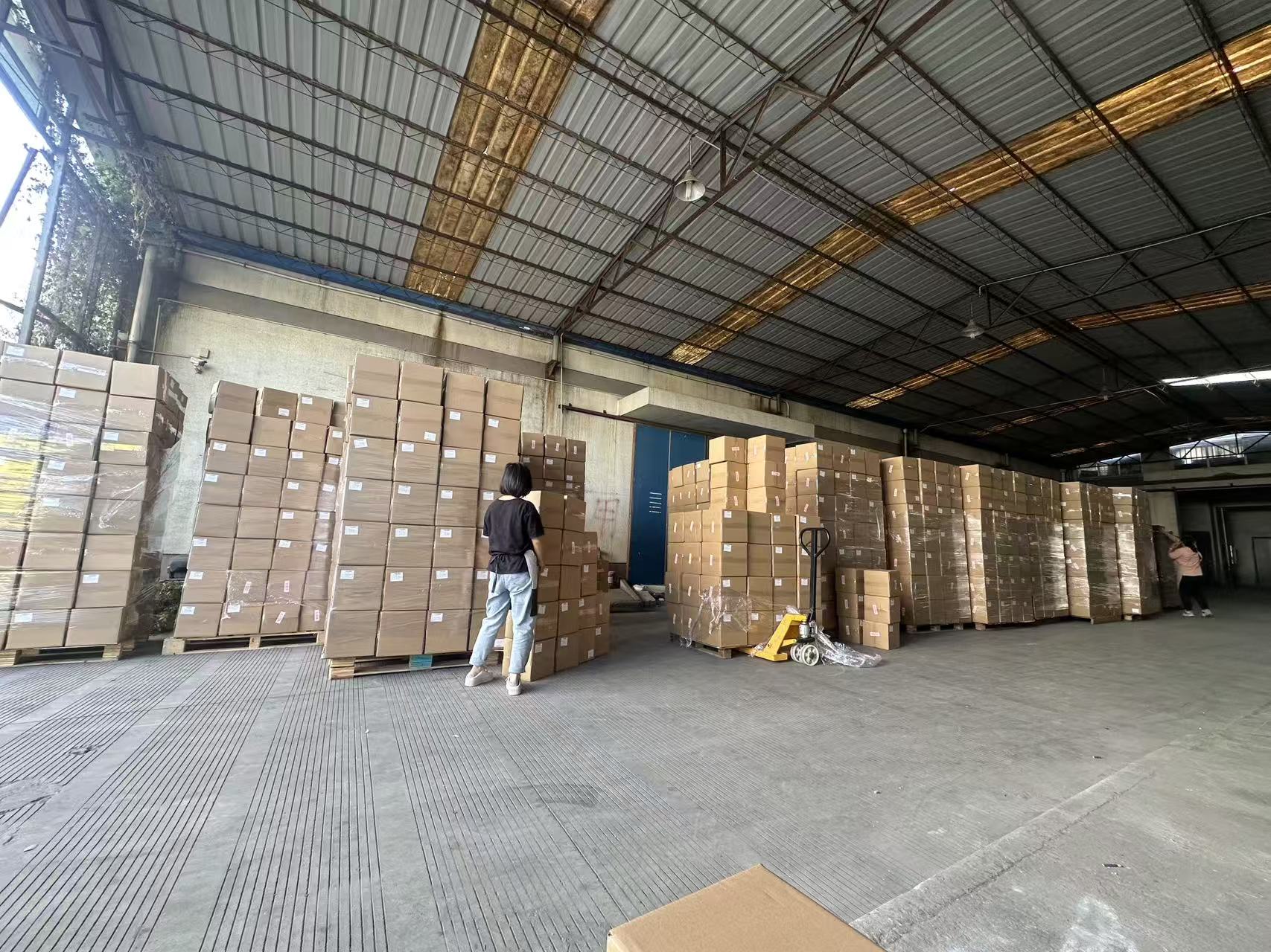 Wrapped pallets of cartons in the cooperating supplier's warehouse